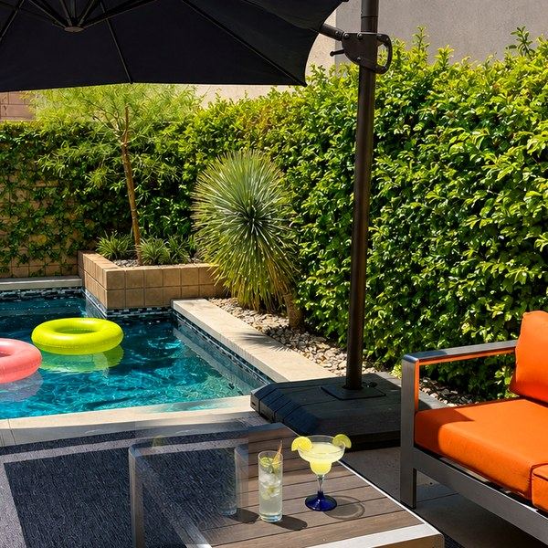 Private pool with umbrella and lounge seating